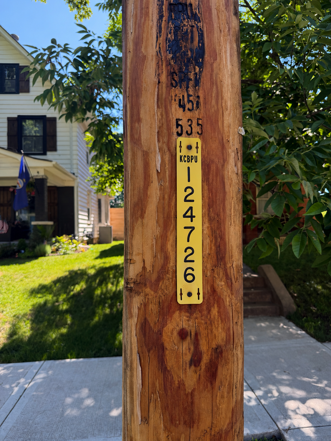 'Look for the KCBPU identification tag attached to the pole.